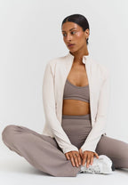 Chaqueta Softsculpt con cremallera blanca - Sisterly Tribe